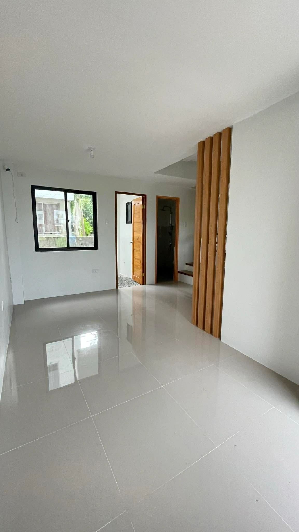 Living area with timber slat stair divider